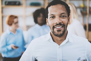 man standing in a white button down