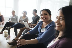 support group in an addiction treatment center smiling with each other