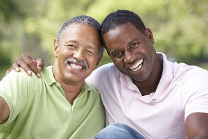 two men sitting outside their Addiction Treatment & Therapies center