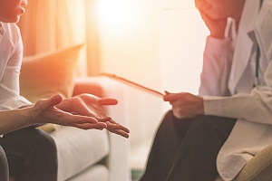 two people engaged in counseling therapy substance abuse treatment