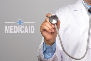 doctor next to words saying medicaid